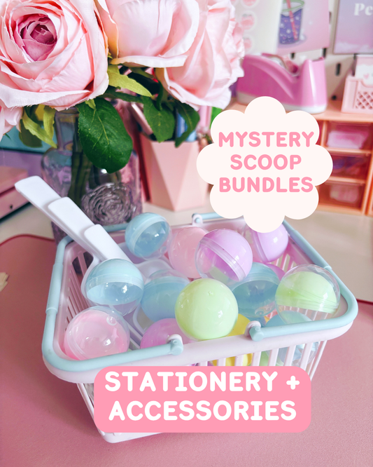 Basket of colorful mystery scoop capsules with flowers and text overlay on a pink surface